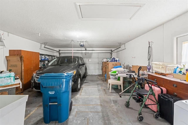 9188 Rhett Ln, Weeki Wachee, FL 34613 - garage featuring a garage door opener and washer / clothes dryer