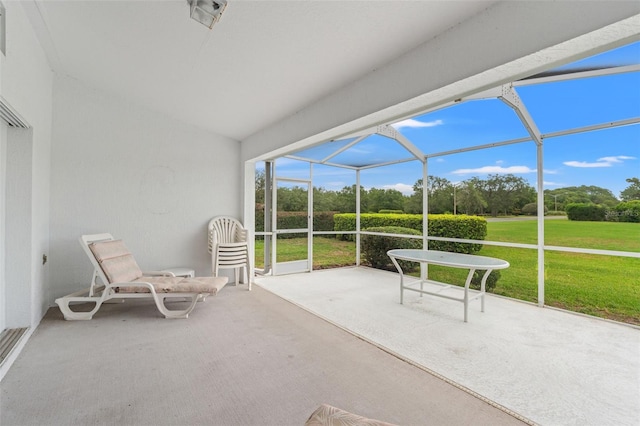 9188 Rhett Ln, Weeki Wachee, FL 34613 - sunroom / solarium featuring lofted ceiling and view of wooded area