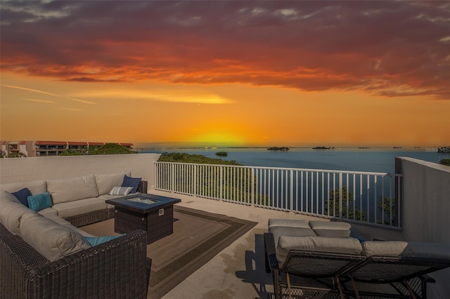2750 Reserve Ct Unit 101, Dunedin, FL 34698 - view of patio with an outdoor living space with a fire pit and a water view