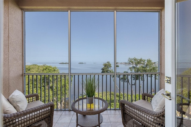 2750 Reserve Ct Unit 101, Dunedin, FL 34698 - sunroom / solarium with a water view