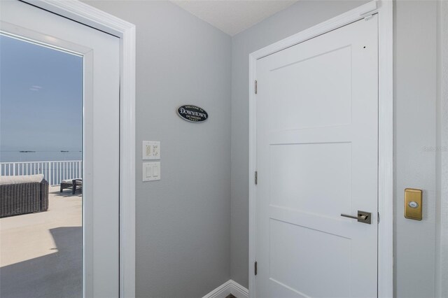 2750 Reserve Ct Unit 101, Dunedin, FL 34698 - entryway featuring baseboards