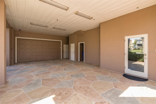 2750 Reserve Ct Unit 101, Dunedin, FL 34698 - garage featuring wooden ceiling