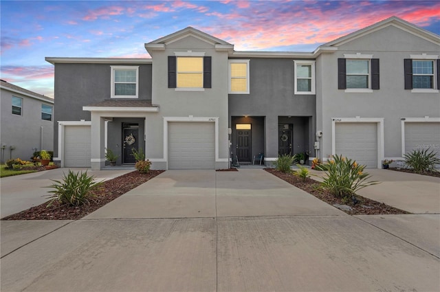32965 Kaloko Rd, Wesley Chapel, FL 33543 - multi unit property featuring stucco siding, driveway, and an attached garage