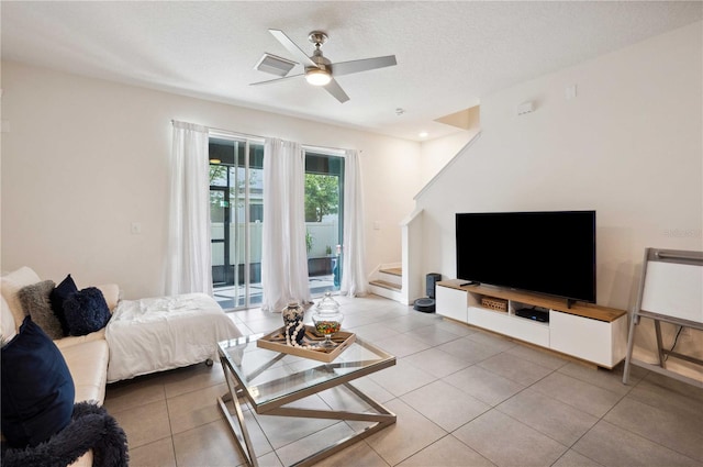 32965 Kaloko Rd, Wesley Chapel, FL 33543 - tiled living area with stairway and ceiling fan