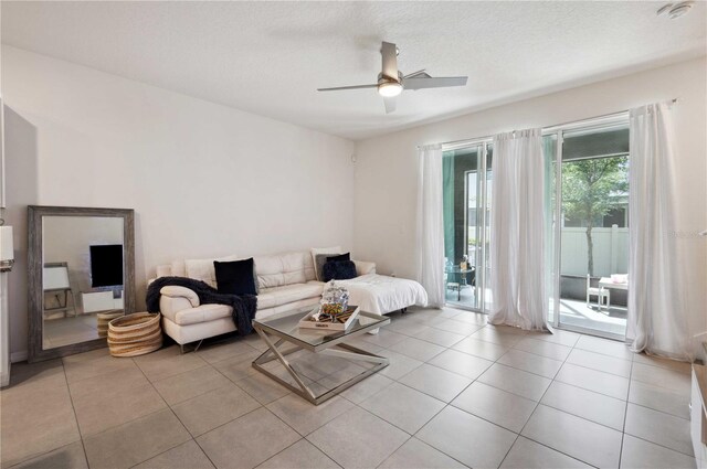 32965 Kaloko Rd, Wesley Chapel, FL 33543 - living area featuring ceiling fan, light tile patterned floors, and a textured ceiling