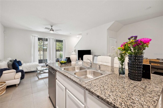 32965 Kaloko Rd, Wesley Chapel, FL 33543 - kitchen with open floor plan, a sink, white cabinets, a ceiling fan, and light tile patterned flooring