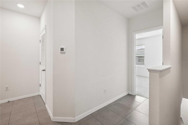 32965 Kaloko Rd, Wesley Chapel, FL 33543 - hallway with tile patterned flooring, baseboards, and recessed lighting