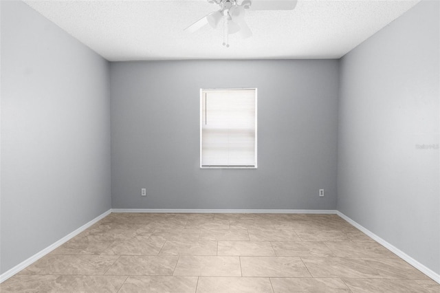 spare room with ceiling fan and a textured ceiling