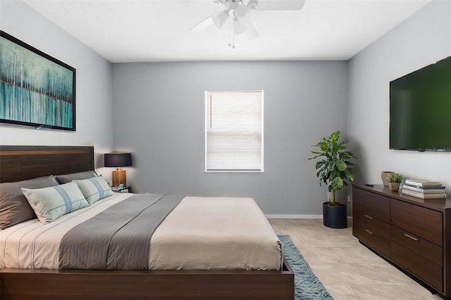 bedroom featuring a ceiling fan and light tile patterned flooring