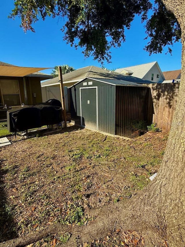 10411 Summerview Cir, Riverview, FL 33578 - view of yard with a storage unit, an outbuilding, and fence