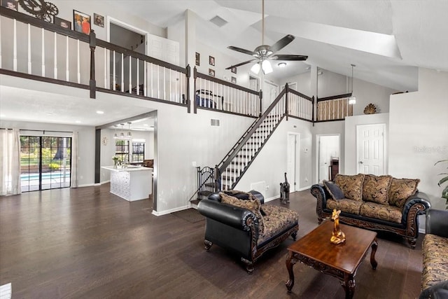 11207 Donneymoor Dr, Riverview, FL 33569 - living area with high vaulted ceiling, wood finished floors, ceiling fan, baseboards, and stairs