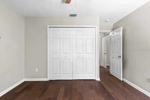 11207 Donneymoor Dr, Riverview, FL 33569 - unfurnished bedroom with dark wood finished floors, a closet, baseboards, and a ceiling fan