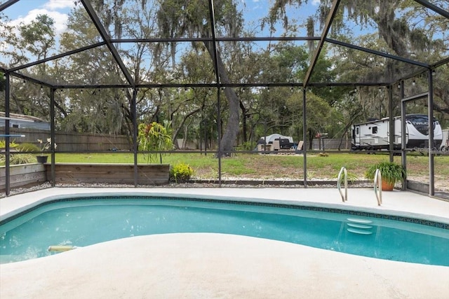 11207 Donneymoor Dr, Riverview, FL 33569 - swimming pool with a lanai, a patio area, a lawn, and view of wooded area