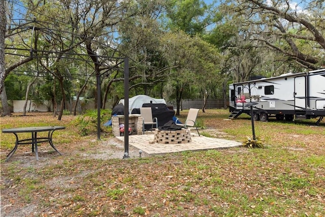 11207 Donneymoor Dr, Riverview, FL 33569 - view of yard with an outdoor fire pit and a patio area