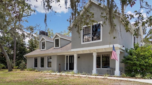 11207 Donneymoor Dr, Riverview, FL 33569 - view of front of property with brick siding and a chimney