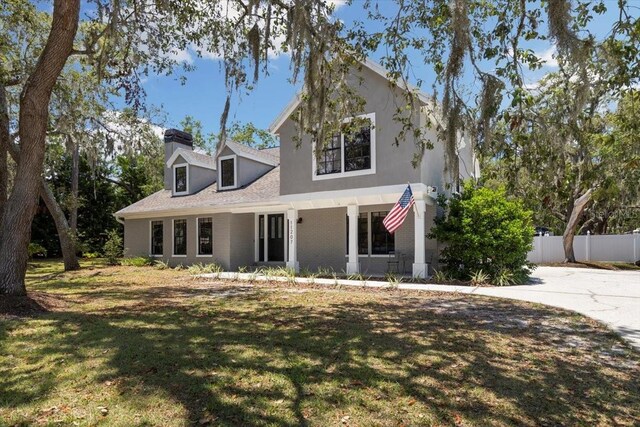 11207 Donneymoor Dr, Riverview, FL 33569 - view of front of property with a chimney and covered porch