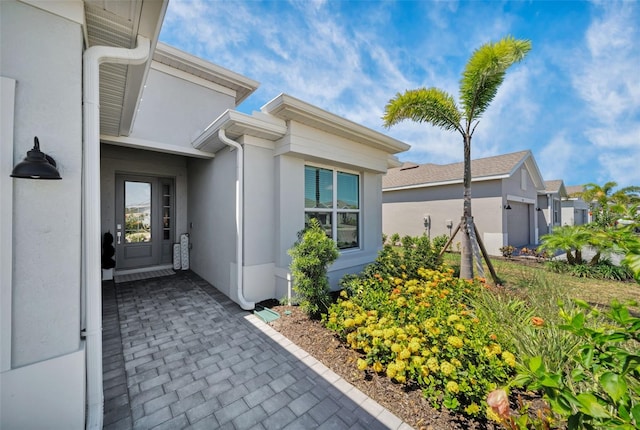 8589 Saint Kitts Cir, Englewood, FL 34224 - view of exterior entry with stucco siding