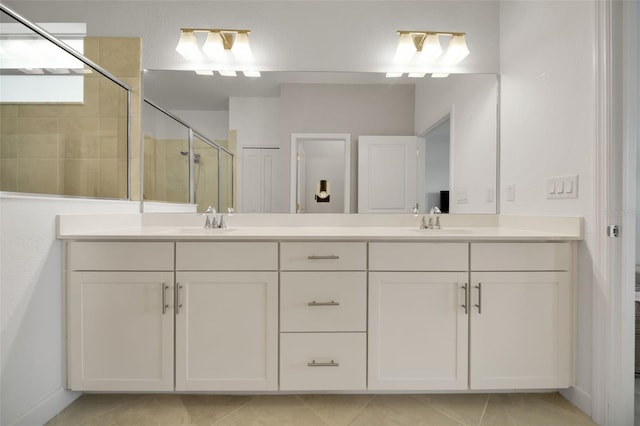 8589 Saint Kitts Cir, Englewood, FL 34224 - full bathroom with a stall shower, double vanity, and tile patterned floors