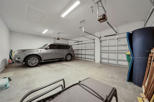 8589 Saint Kitts Cir, Englewood, FL 34224 - garage featuring a garage door opener