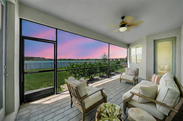 8589 Saint Kitts Cir, Englewood, FL 34224 - sunroom / solarium featuring ceiling fan, outdoor lounge area, and a water view