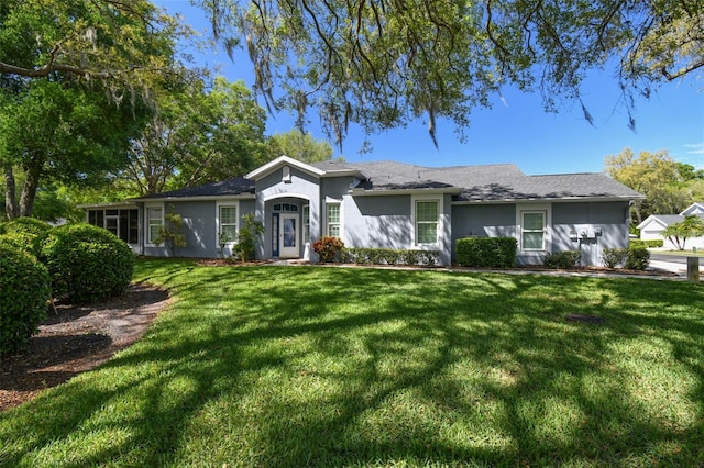 10716 Ashford Oaks Dr, Tampa, FL 33625 - single story home featuring stucco siding and a front lawn