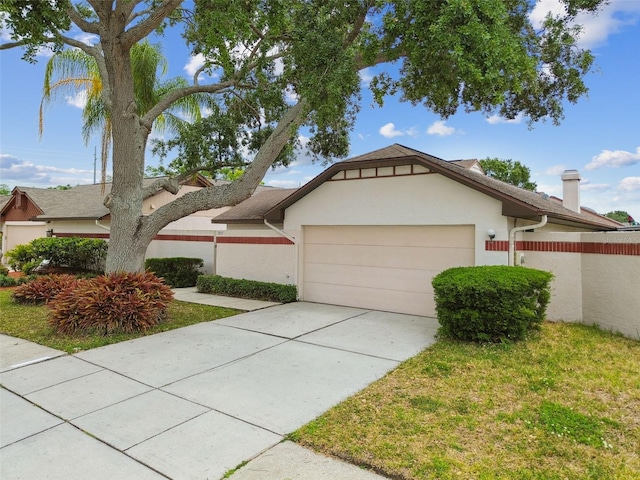 7035 Drury St, Tampa, FL 33635 - view of front of property with an attached garage, stucco siding, concrete driveway, and a chimney