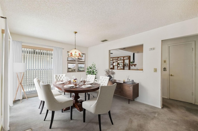 7035 Drury St, Tampa, FL 33635 - dining room with light carpet and a textured ceiling