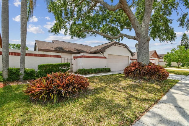 7035 Drury St, Tampa, FL 33635 - view of front of property featuring an attached garage and stucco siding