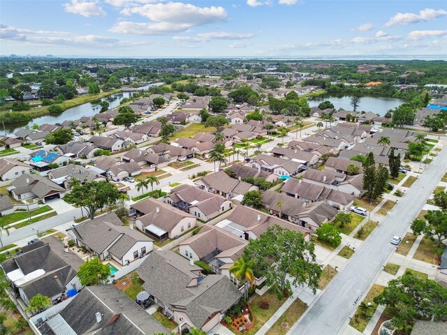 7035 Drury St, Tampa, FL 33635 - aerial view of property and surrounding area featuring a nearby body of water and nearby suburban area