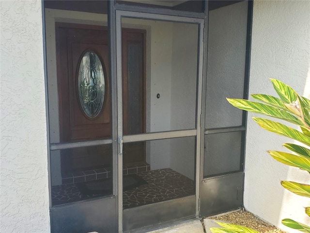 50 Water Oak Way, Oldsmar, FL 34677 - doorway to property with stucco siding