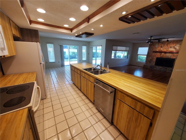 50 Water Oak Way, Oldsmar, FL 34677 - kitchen featuring stainless steel dishwasher, butcher block counters, a sink, open floor plan, and recessed lighting