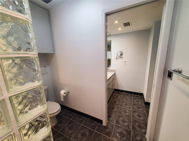 50 Water Oak Way, Oldsmar, FL 34677 - bathroom featuring tile patterned floors, vanity, toilet, baseboards, and recessed lighting