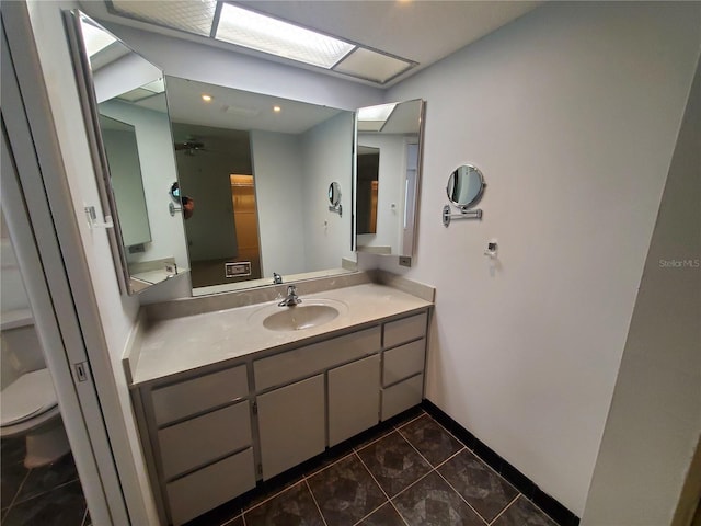 50 Water Oak Way, Oldsmar, FL 34677 - bathroom with toilet, tile patterned floors, vanity, baseboards, and recessed lighting