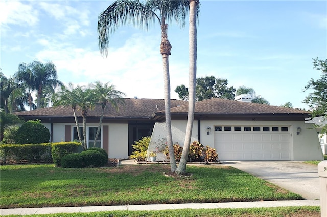 50 Water Oak Way, Oldsmar, FL 34677 - ranch-style home featuring stucco siding, driveway, a garage, and a front lawn
