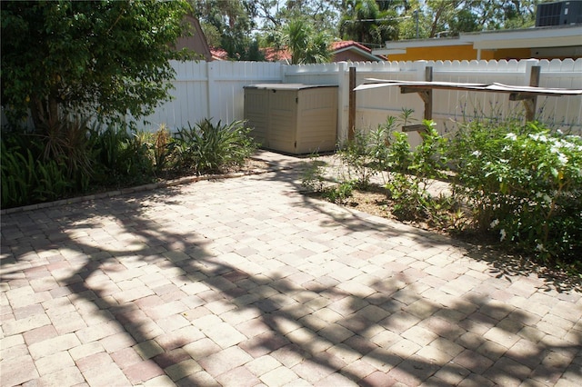 view of patio / terrace with fence and central AC