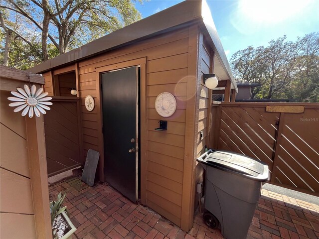 2406 Cypress Pond Rd Unit 2406, Palm Harbor, FL 34683 - view of outdoor structure featuring fence and an outbuilding