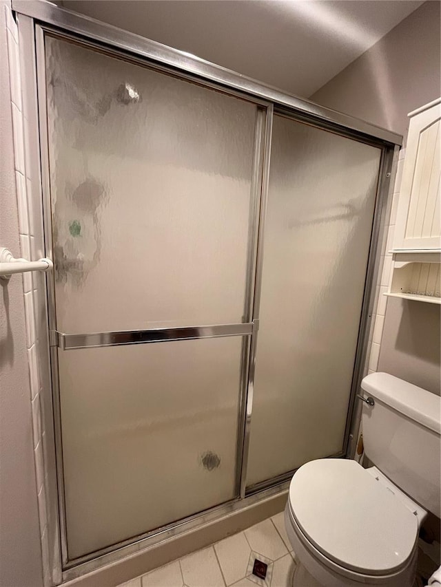 2406 Cypress Pond Rd Unit 2406, Palm Harbor, FL 34683 - full bath with tile patterned floors, a stall shower, and toilet