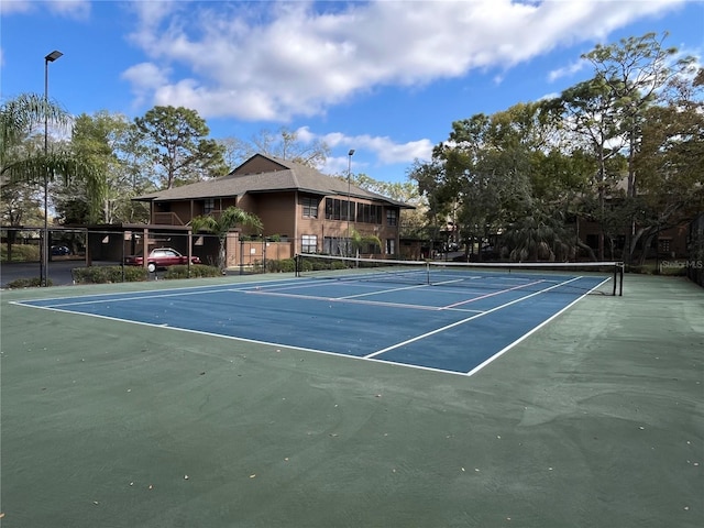 2406 Cypress Pond Rd Unit 2406, Palm Harbor, FL 34683 - view of tennis court featuring fence and community basketball court