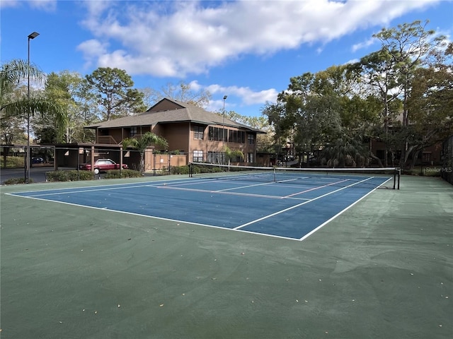 2406 Cypress Pond Rd Unit 2406, Palm Harbor, FL 34683 - view of tennis court featuring fence and community basketball court