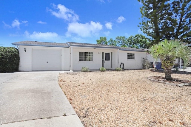 3247 Kimberly Oaks Dr, Holiday, FL 34691 - single story home featuring an attached garage, driveway, and stucco siding