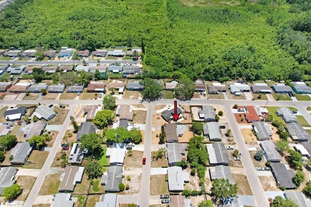 3247 Kimberly Oaks Dr, Holiday, FL 34691 - aerial view of property and surrounding area with nearby suburban area and a heavily wooded area
