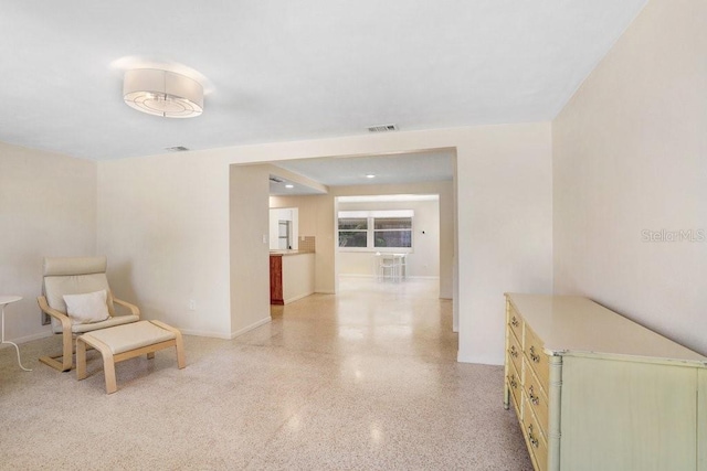3247 Kimberly Oaks Dr, Holiday, FL 34691 - unfurnished room with dark aggregate flooring and baseboards