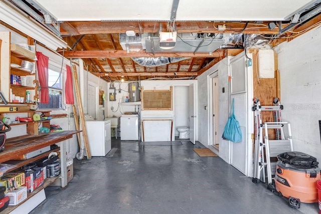 3247 Kimberly Oaks Dr, Holiday, FL 34691 - garage featuring washer / dryer, a garage door opener, and water heater