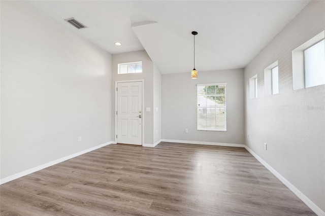 entryway featuring plenty of natural light, baseboards, wood finished floors, and recessed lighting