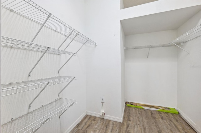 spacious closet with wood finished floors