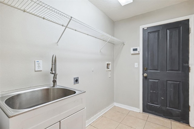 laundry area featuring washer hookup, light tile patterned flooring, baseboards, and electric dryer hookup