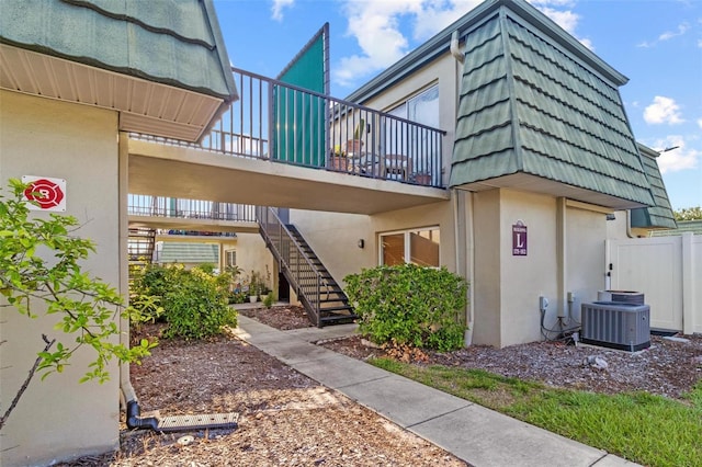 1799 N Highland Ave Unit 180, Clearwater, FL 33755 - view of building exterior featuring central AC and stairs