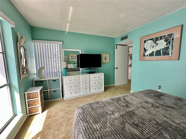 320 Medallion Blvd Unit G, Madeira Beach, FL 33708 - bedroom featuring carpet and a textured ceiling
