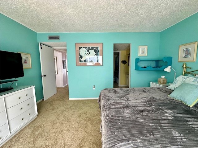 320 Medallion Blvd Unit G, Madeira Beach, FL 33708 - carpeted bedroom with a textured ceiling and baseboards