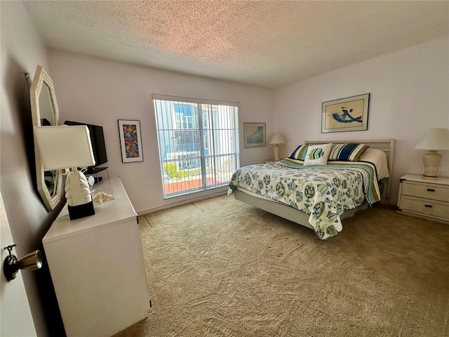 320 Medallion Blvd Unit G, Madeira Beach, FL 33708 - carpeted bedroom with a textured ceiling